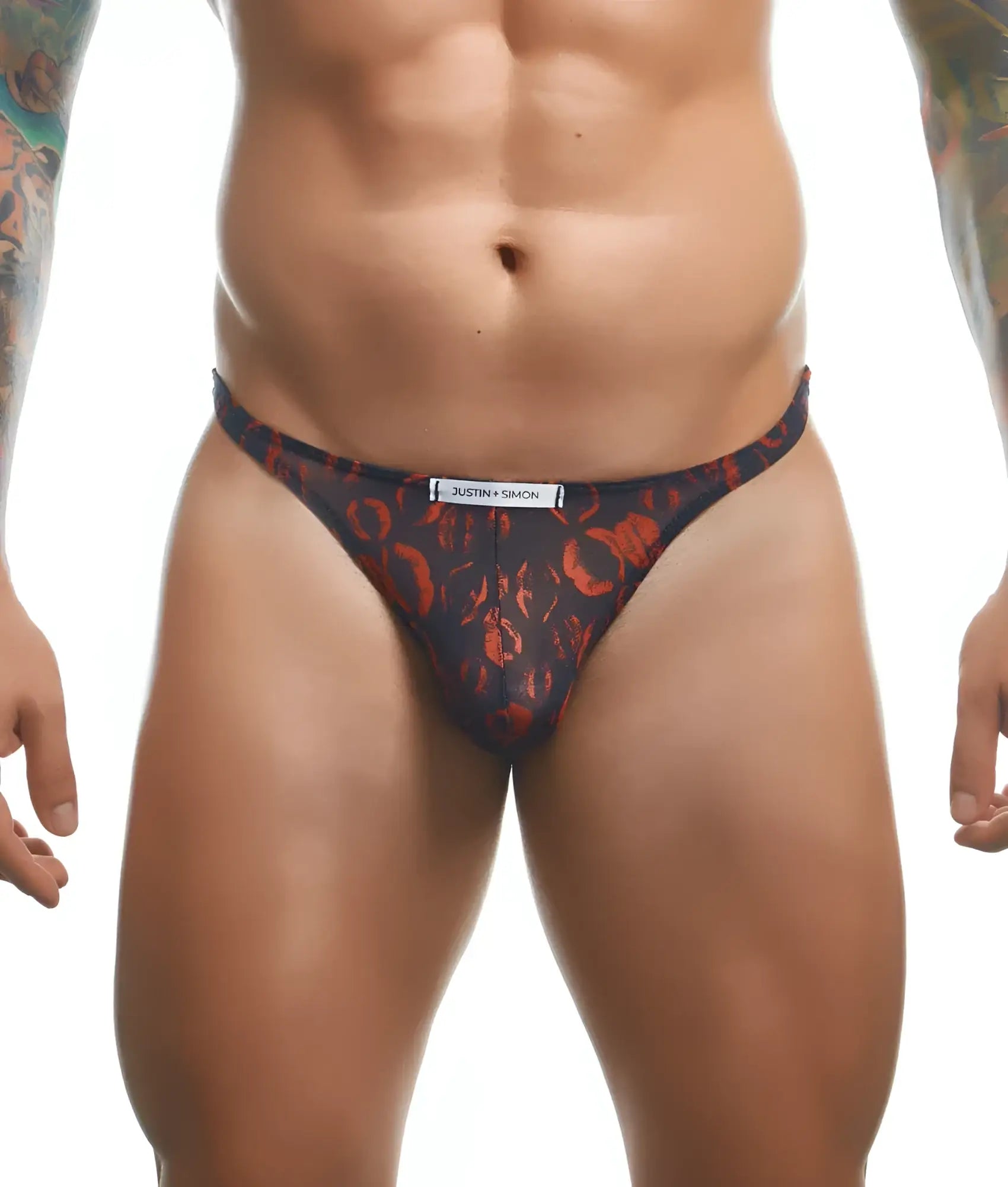 Dark blue thong with bold orange abstract pattern and justin simon label on waistband from Justin Simon classic tanga fun prints