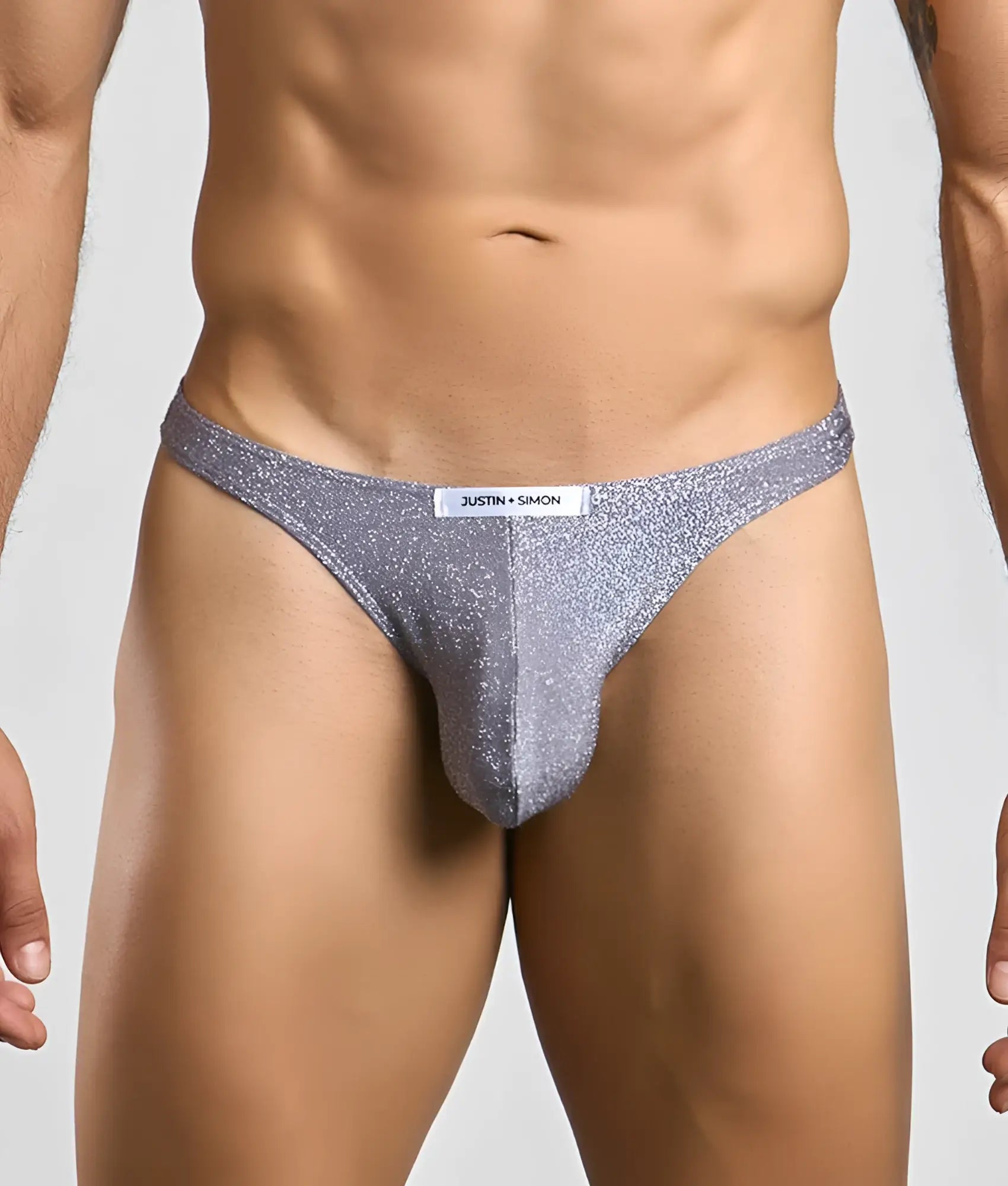 Silver glittery thong from justin simon classic tanga featuring a sleek and shiny design