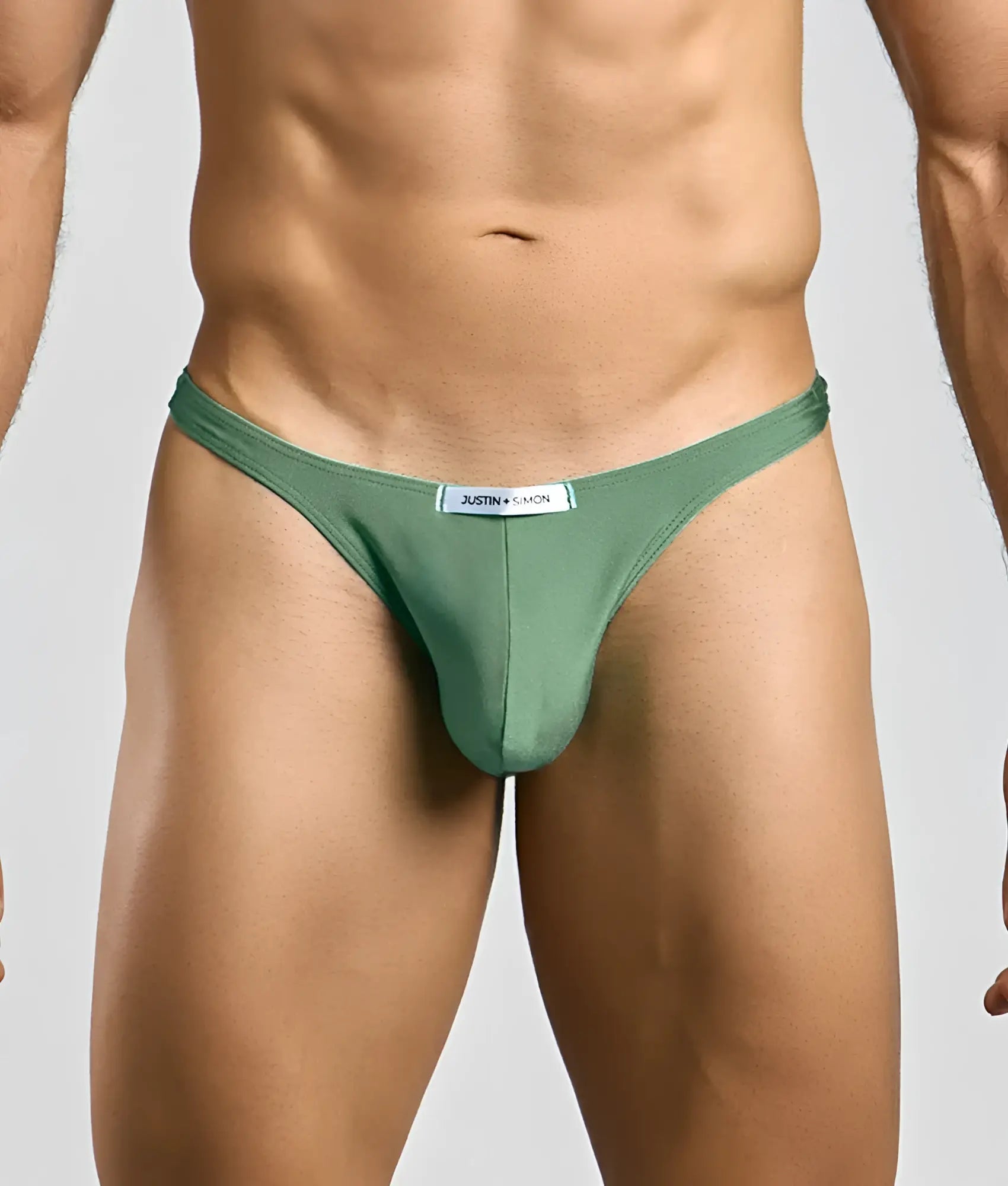 Justin + Simon classic tanga in sleek olive green smooth fabric with minimalist design and small white waistband label