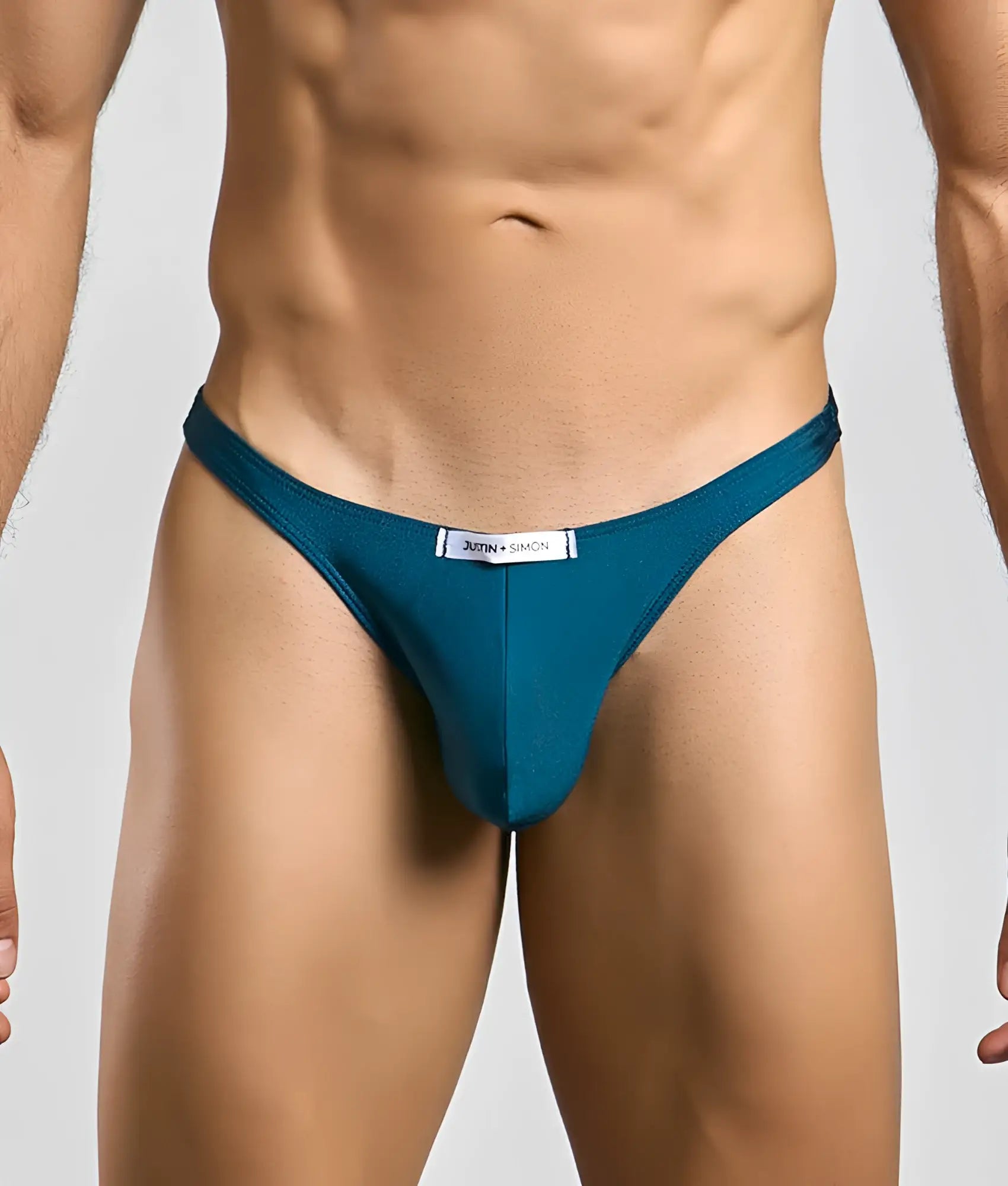 Teal jutin and simon thong classic tanga with a sleek form-fitting design in soft comfortable fabric