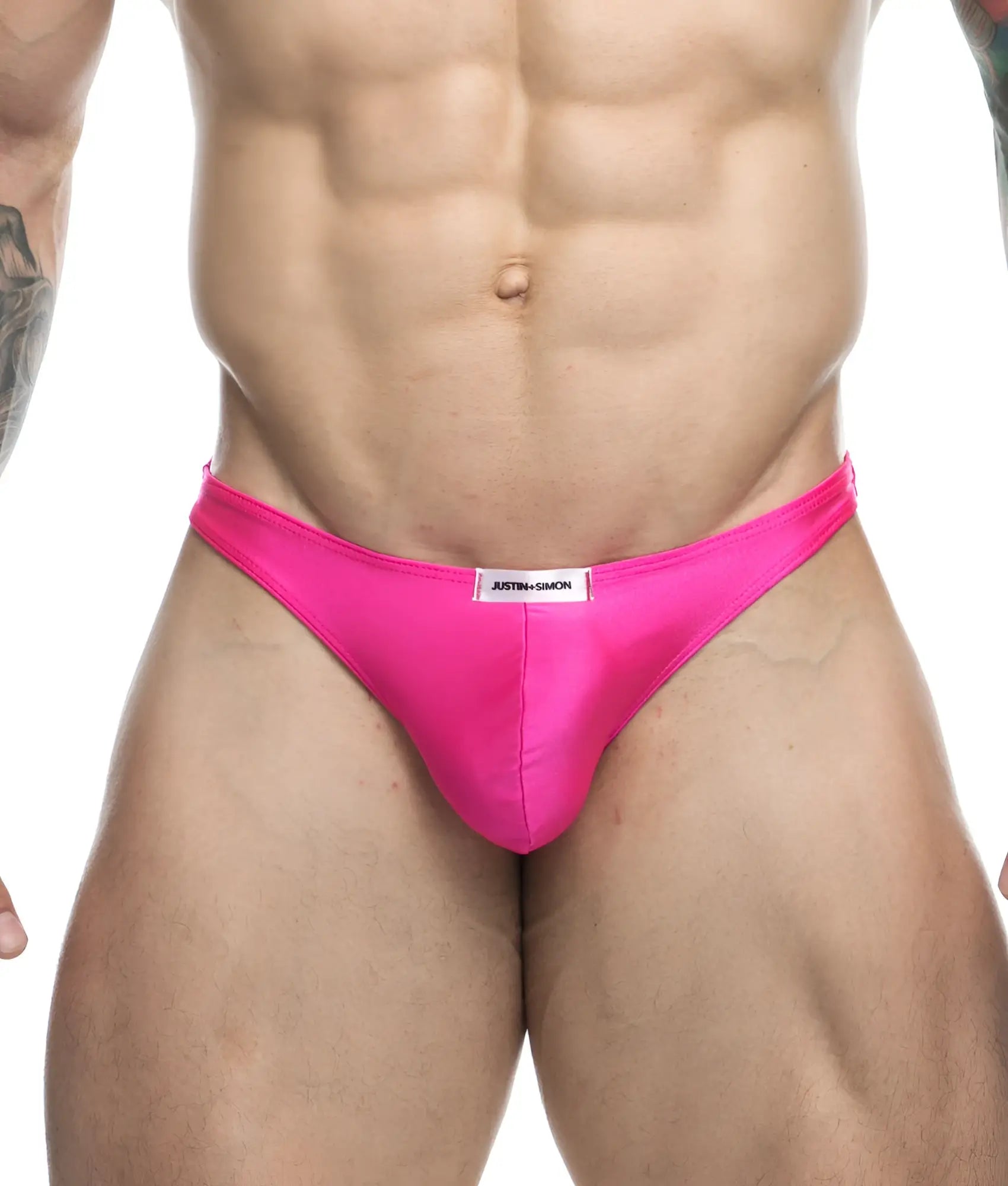 Vibrant pink satin Justin + Simon classic tanga briefs with a sleek form-fitting design and white brand label at waistband