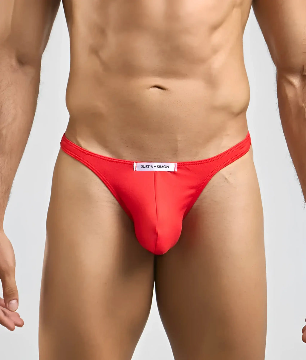 Red justin simon thong with white waistband label made of peachskin fabric for men’s sexy tanga underwear