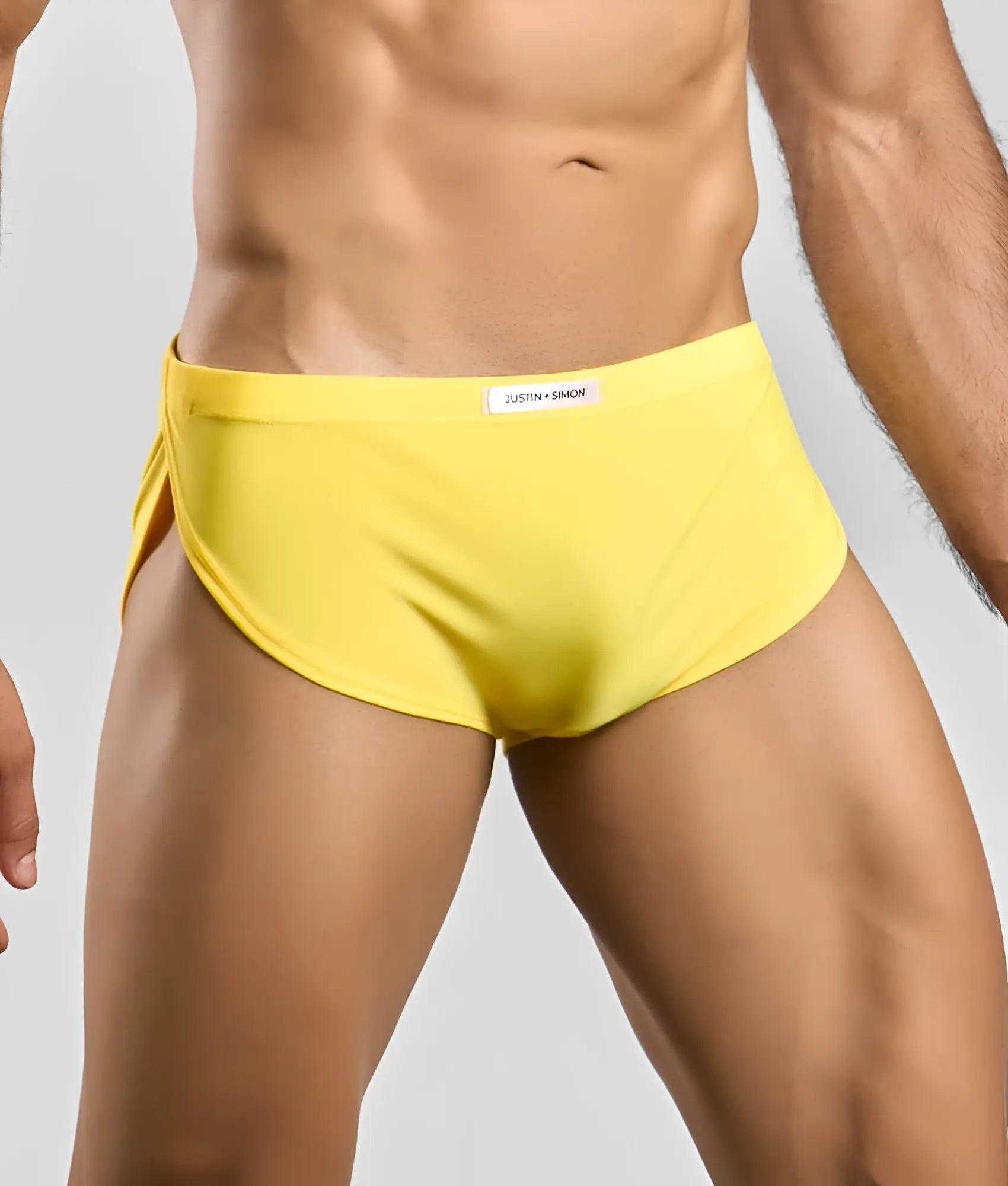 Bright yellow justin simon running shorts with sleek form-fitting design for swim and activewear use