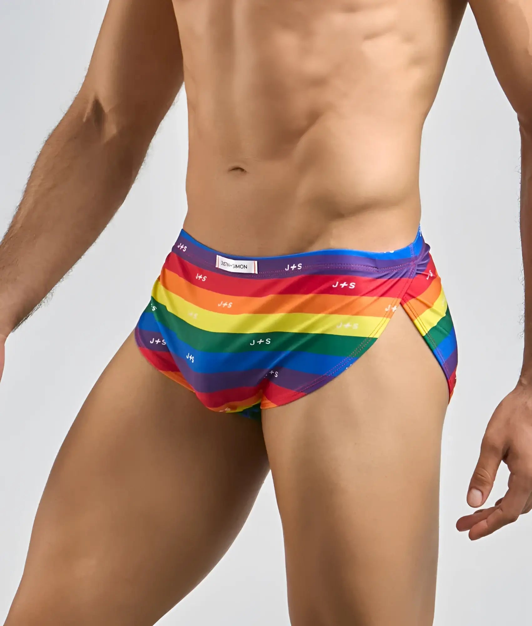 Justin and simon running short swim trunks with rainbow stripes and repeating brand logo in vibrant colors