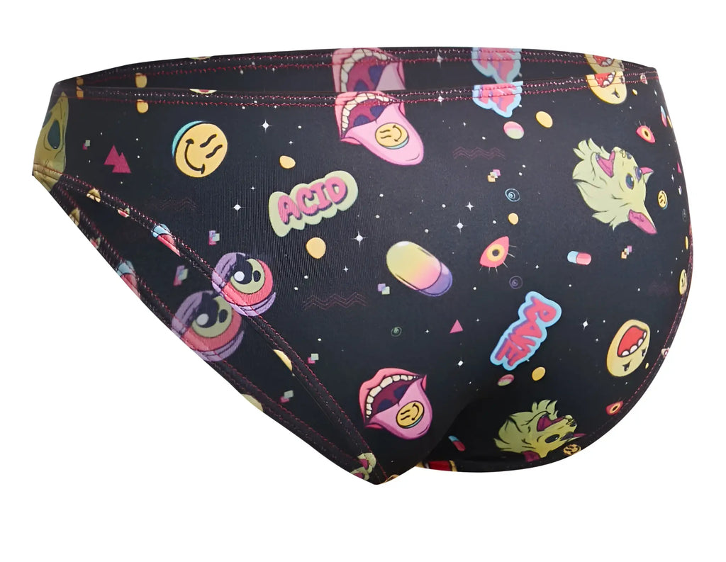 Black swim trunks with vibrant psychedelic pattern featuring smiling faces cartoon mouths and acid lettering by justin simon