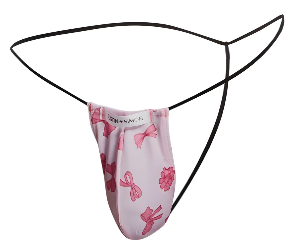 Pink bow-patterned justin + simon classic g-string with black elastic straps shown from the back side