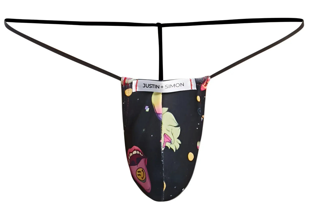 Black justin simon thong with vibrant cartoon graphic of pink lips yellow hair and celestial elements on dark background