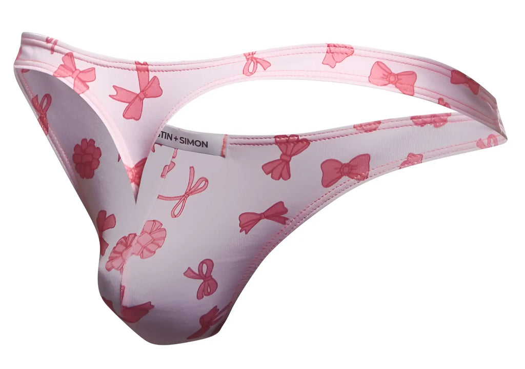 Pink bow-patterned men’s thong by martin+simon from the justin+simon xsj03 classic thongs color coquette line