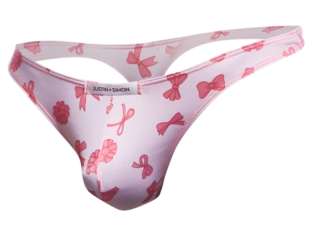 Pink bow-patterned classic thong by Justin + Simon in coquette color showing front side design details