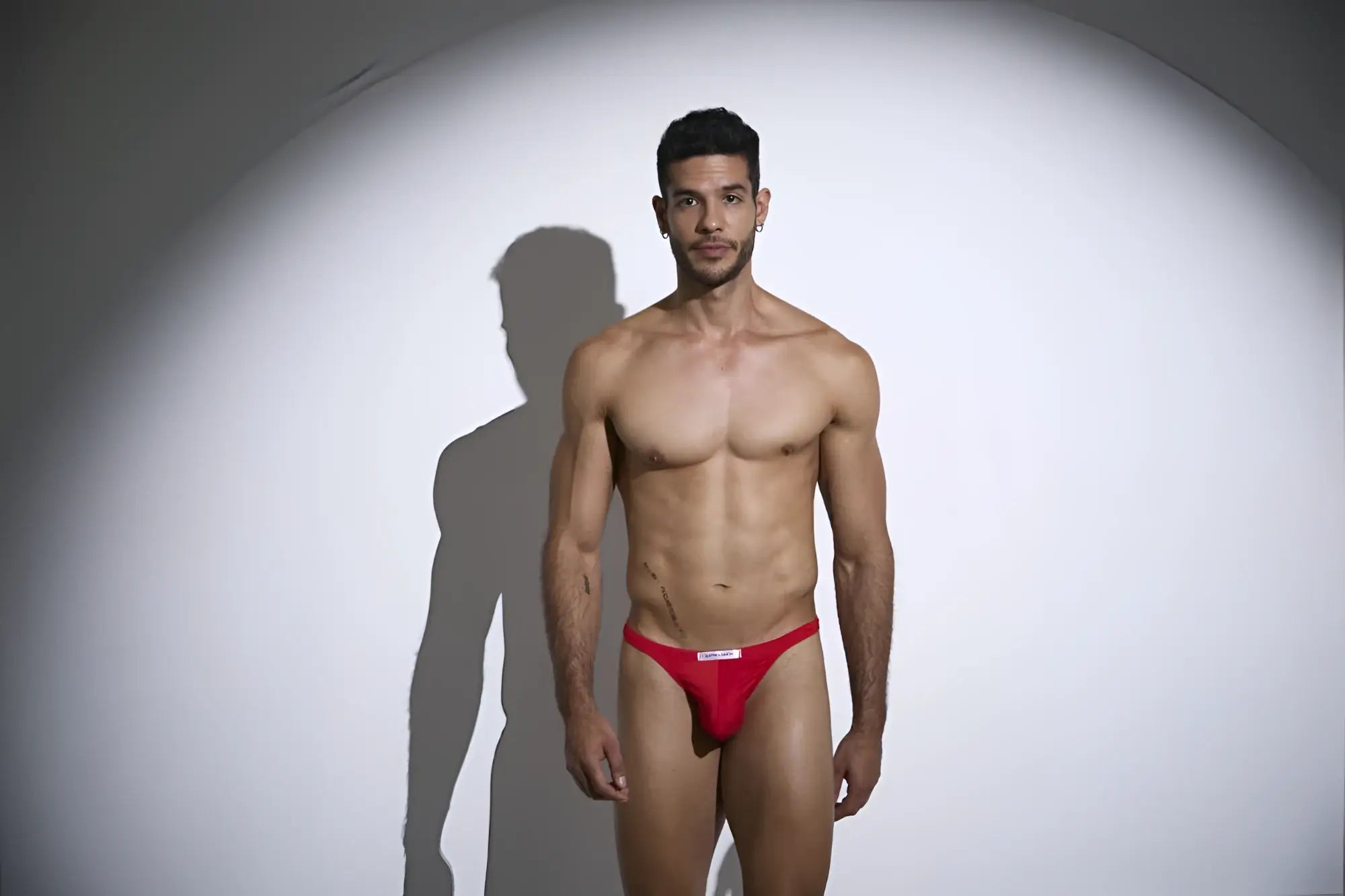 Justin Simon xsj03 classic thongs in peach red with a small white logo on the front made of soft athletic fabric