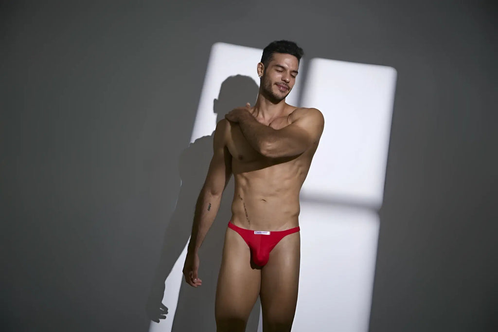 JustIn Simon classic peach red thongs with a white logo waistband in red briefs style front view