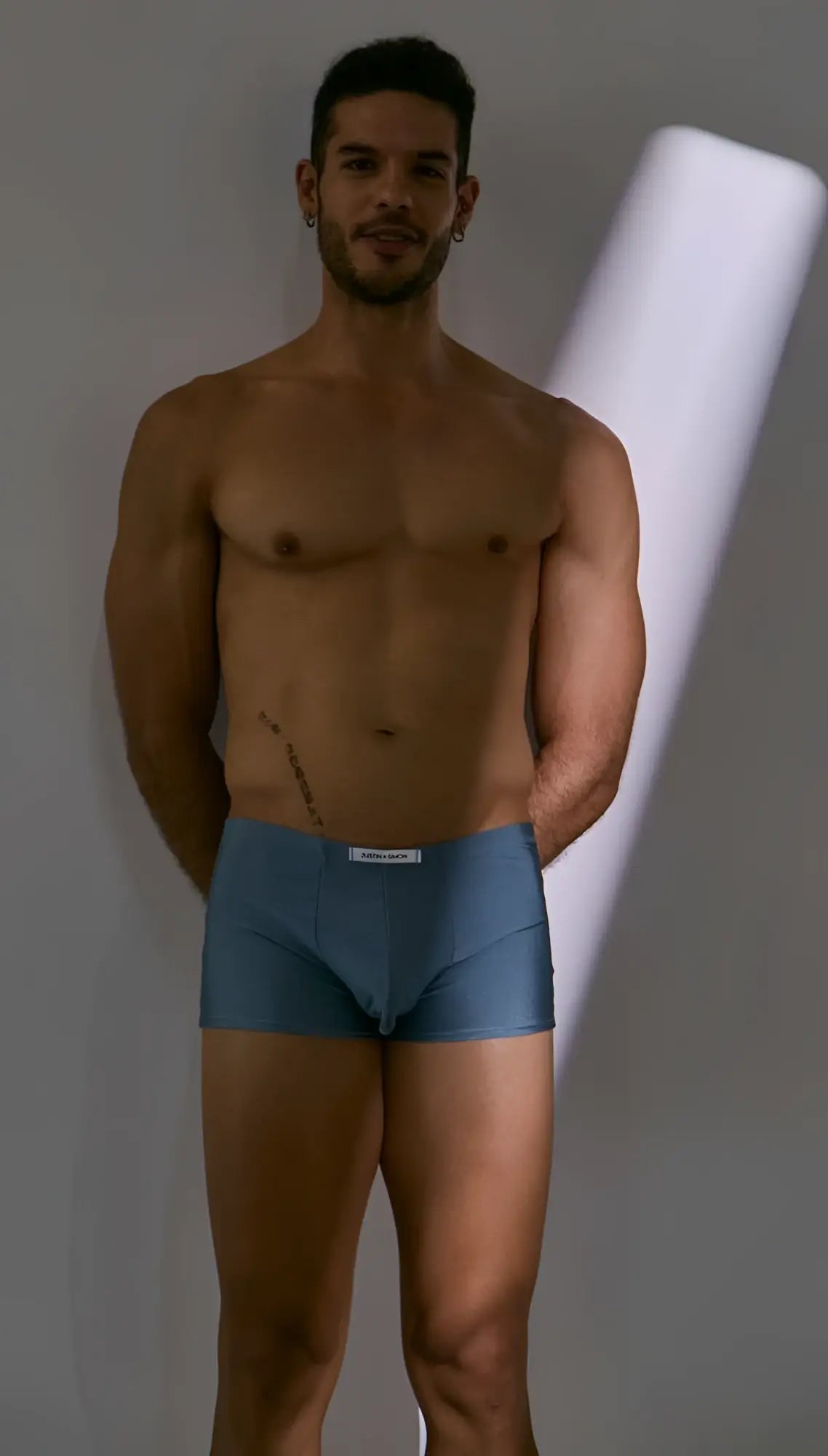 Blue men’s boxer briefs with white waistband label in classic metal green by justin simon xsj08