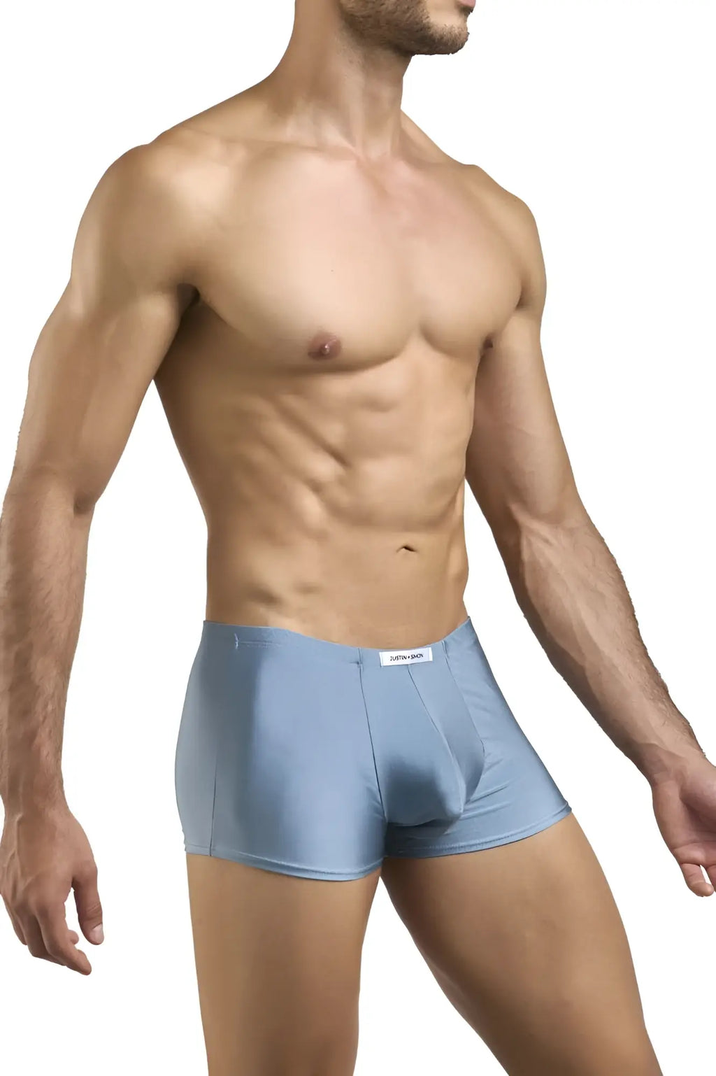 Light blue form-fitting boxer briefs with subtle textured fabric and white brand tag from justin simon xsj08 classic boxer metal green collection