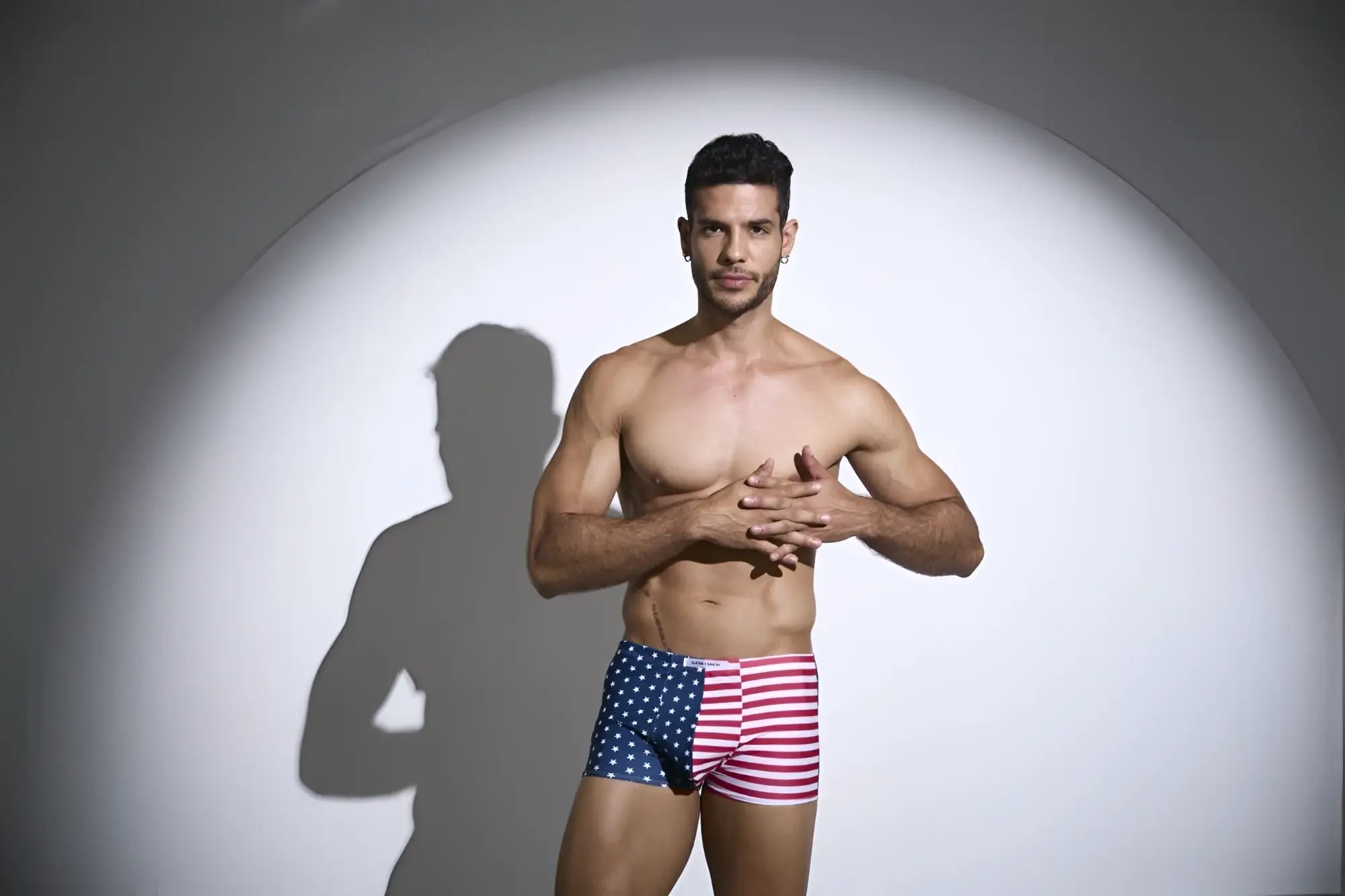 A man wearing justin simon xsj08 classic boxer briefs in usa flag colors with stars and stripes pattern