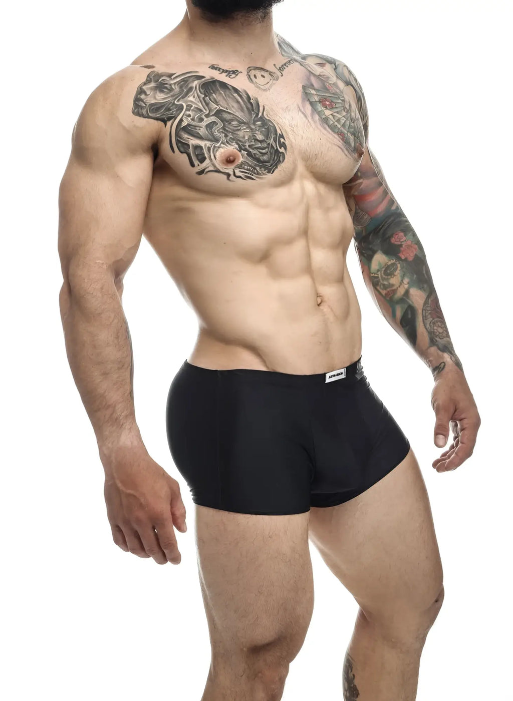 Black justin simon xsj08 classic briefs with a small white logo on the waistband made from soft fabric