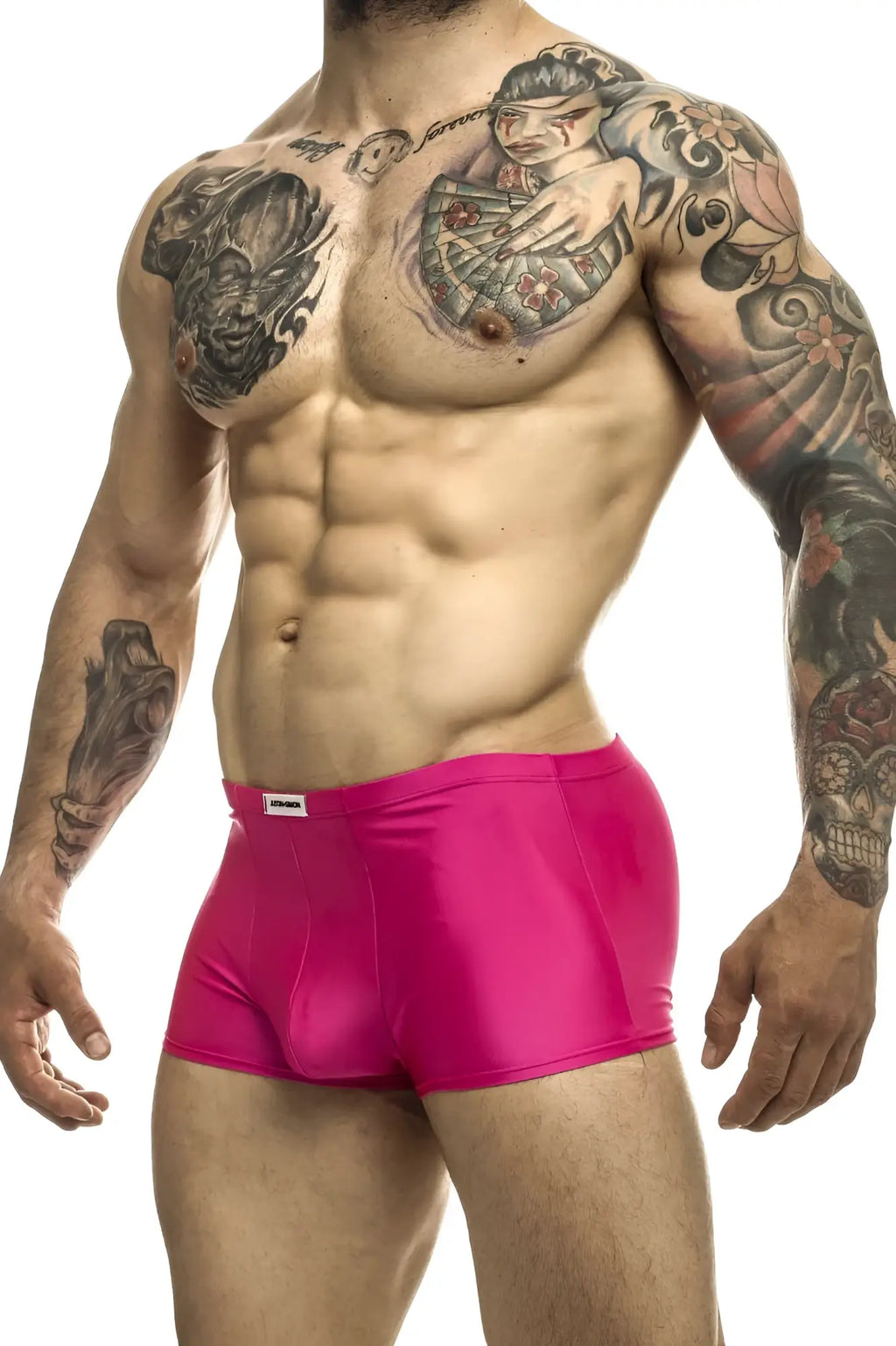 Bright pink shiny fabric briefs with a white brand tag on the waistband from justin+simon xsj08 classic trunks collection