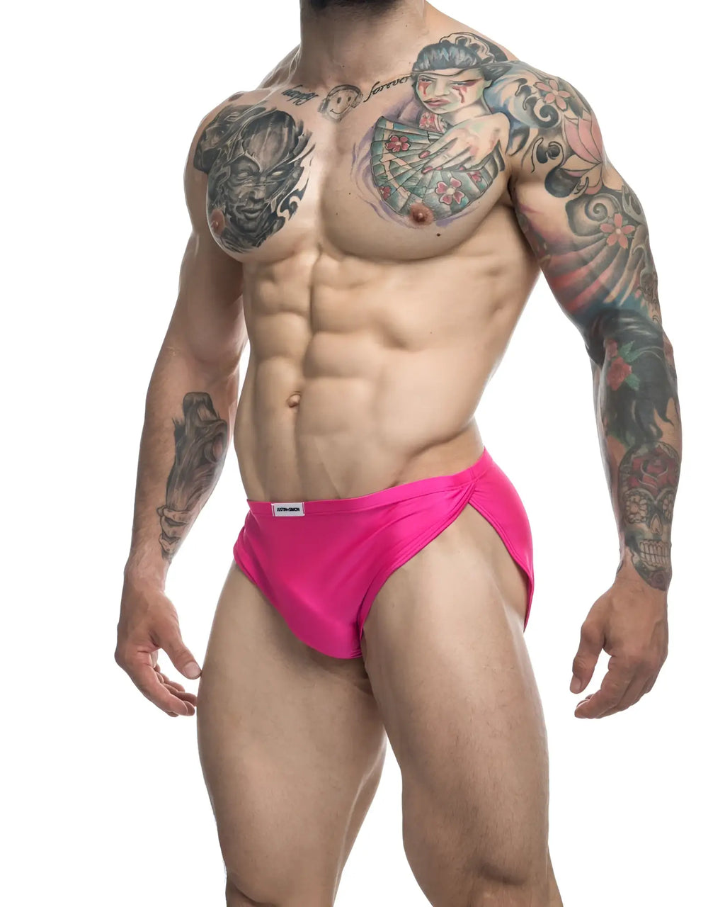 Bright pink justin simon xsj09 running shorts with a snug fit and small white label at the waistband