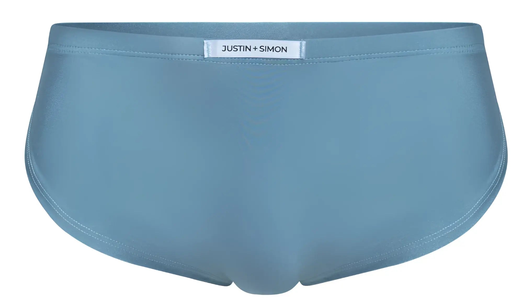 Light blue justin simon briefs with smooth seamless fabric finish shown with xsj09 metal green running shorts