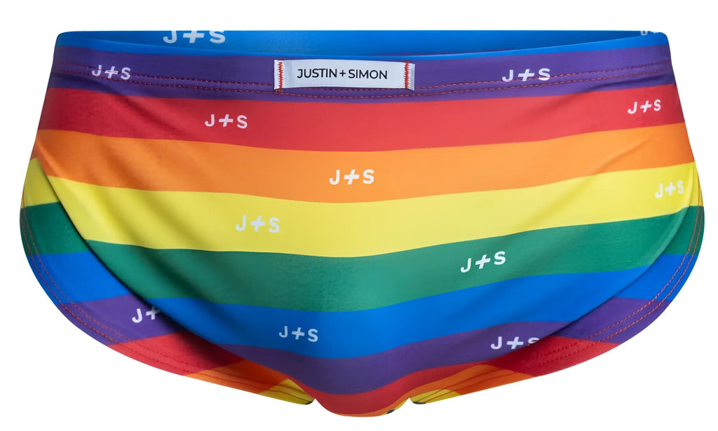 Justin Simon rainbow-striped men’s briefs with white j+s logo pattern in pride flag colors from xsj09 collection