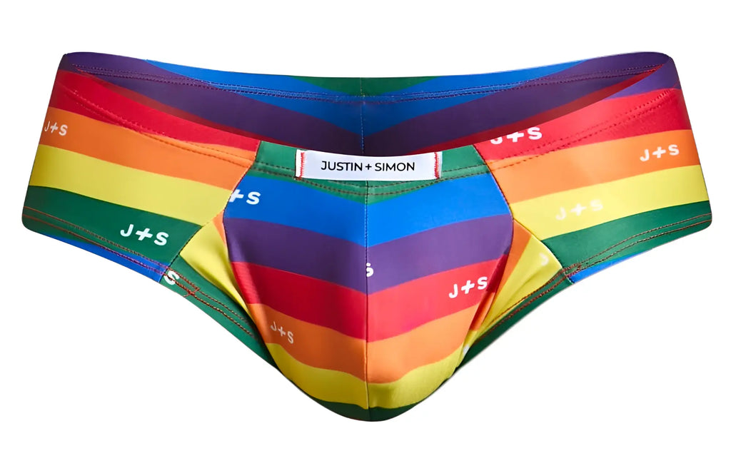 Rainbow-striped mens briefs by justin + simon with bold diagonal pride colors and repeating j+s branding