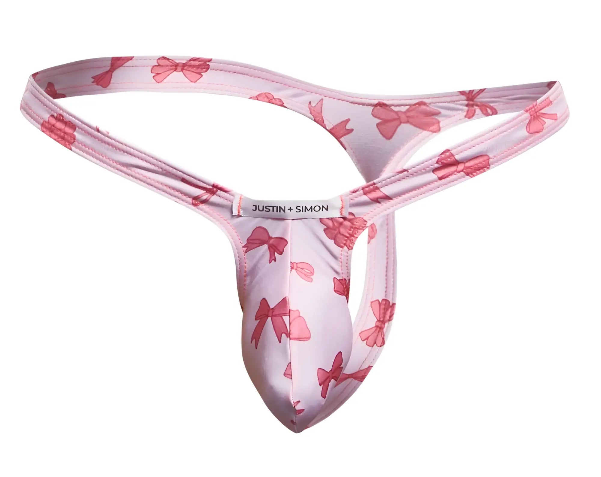 Pink bow-patterned justin + simon coquette bulge thong in XSJBU02 style showing front view