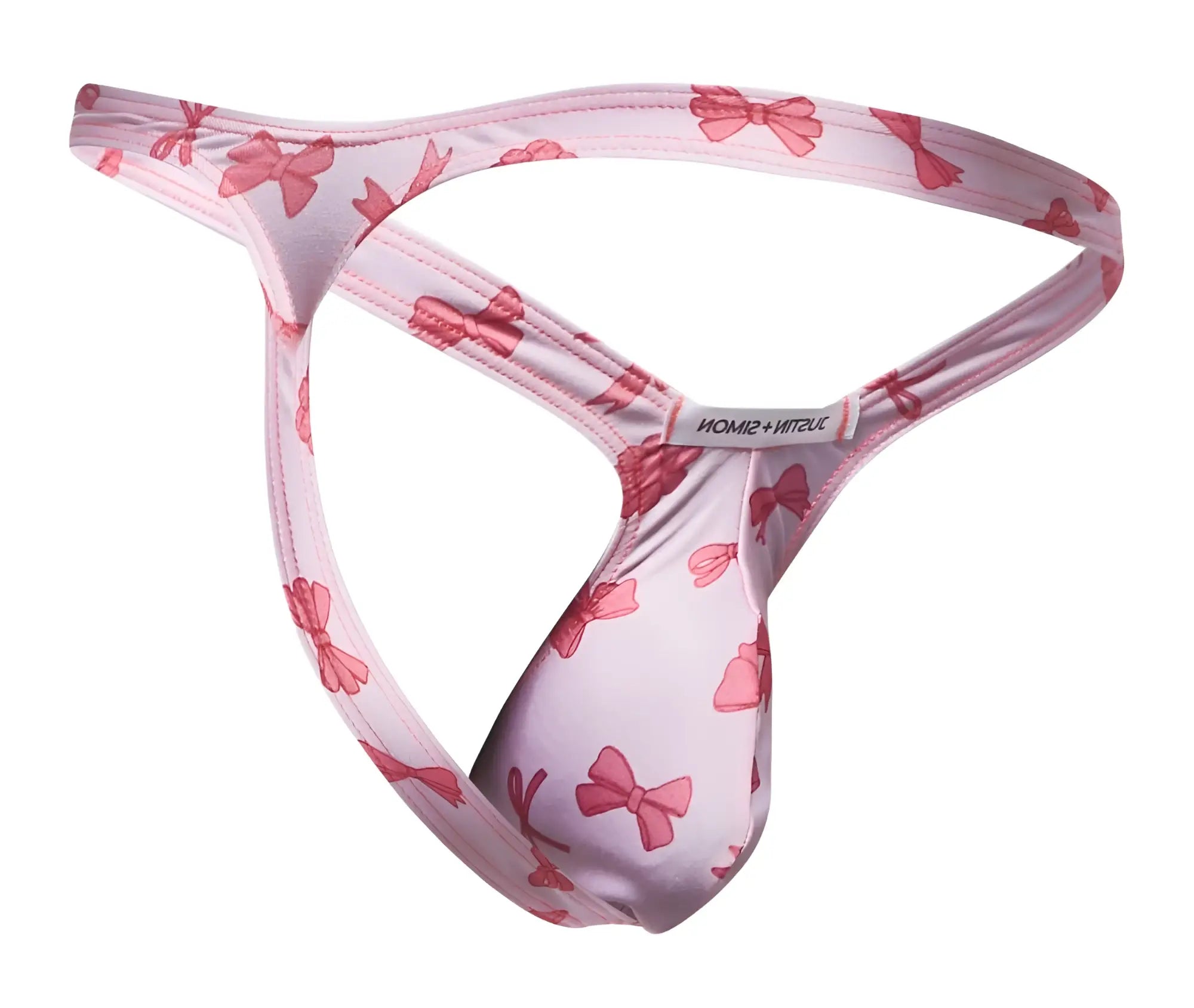 Pink bow-patterned justin simon coquette bulge thong in soft stretchy fabric with branded tag visible