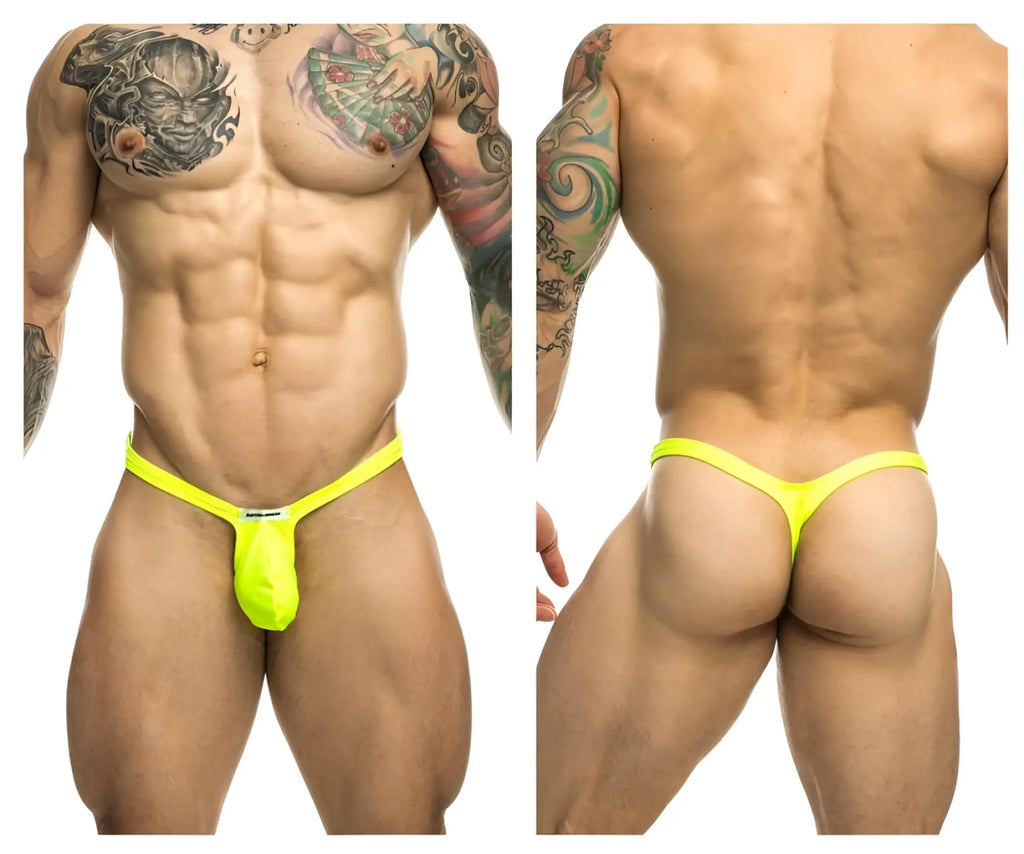 Bright neon yellow justin simon xsjbu02 bulge thong with small white brand tag at front for minimalist wear