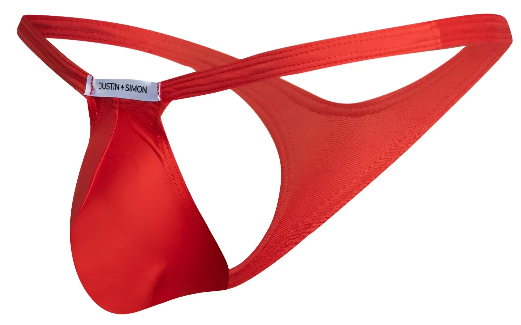Red justin simon bulge thong in peach red made of smooth satin like fabric with a sleek minimalist design