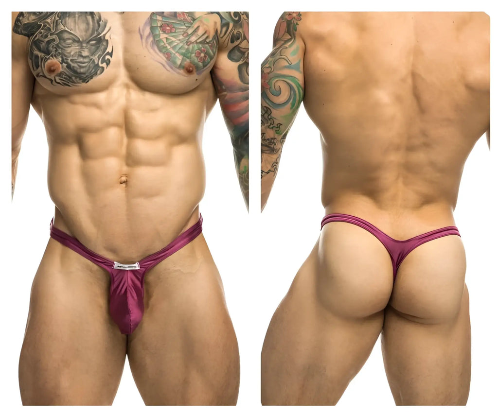 A vibrant magenta satin bulge thong by justin simon with a sleek design and a small metallic clasp at the front