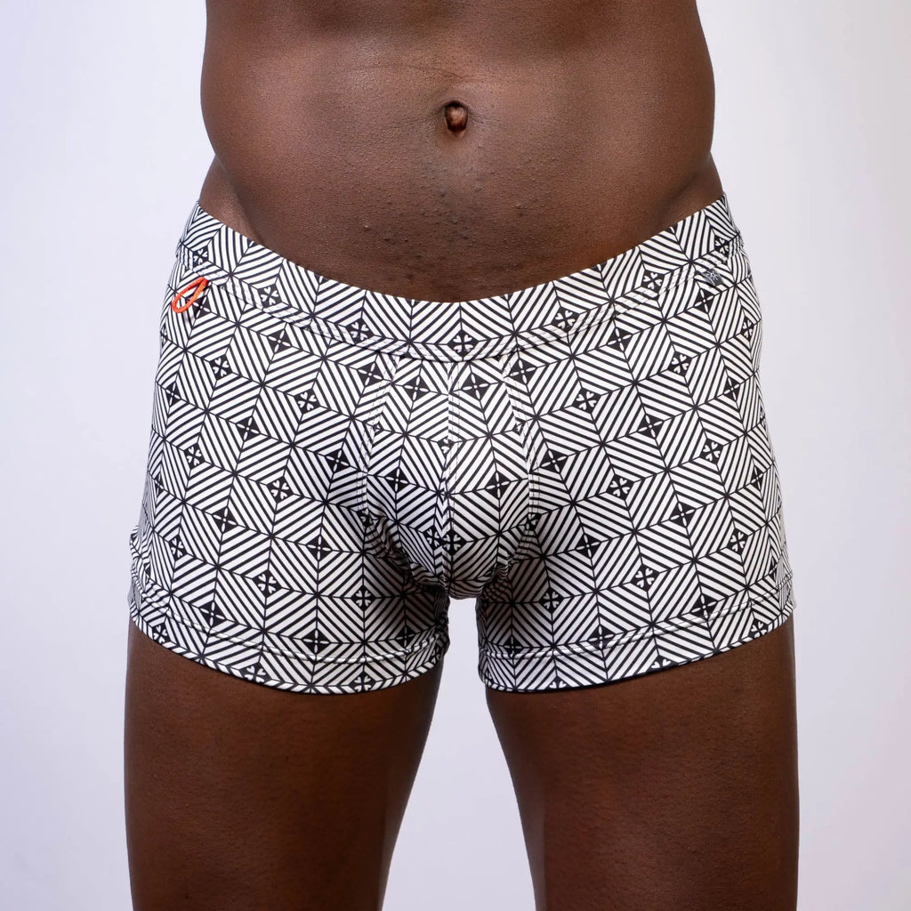 Kaleidoscope sq cut trunk black and white geometric patterned boxer briefs with subtle orange logo on waistband