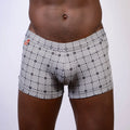 Kaleidoscope sq cut trunk black and white geometric patterned boxer briefs with subtle orange logo on waistband