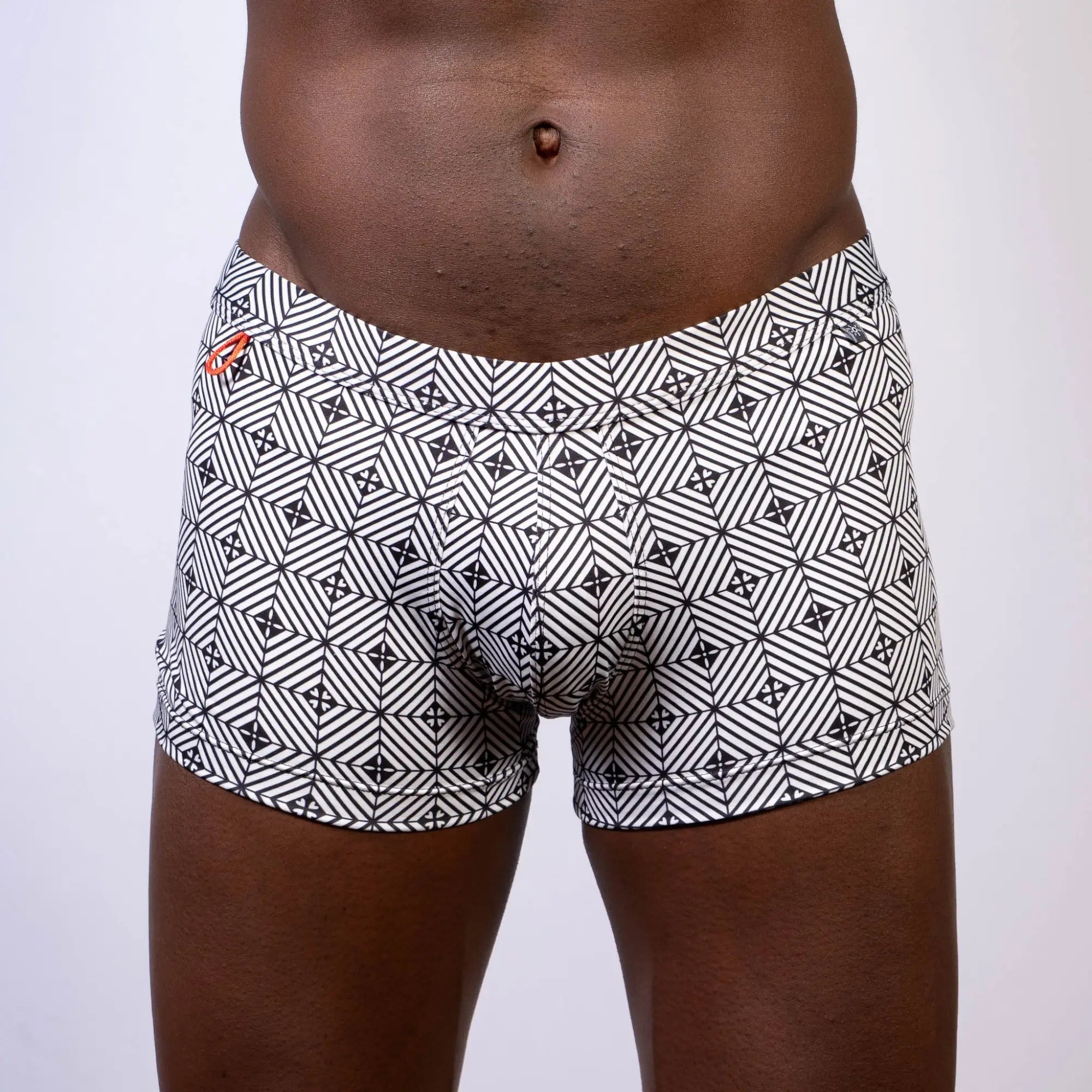 Kaleidoscope sq cut trunk black and white geometric patterned boxer briefs with subtle orange logo on waistband