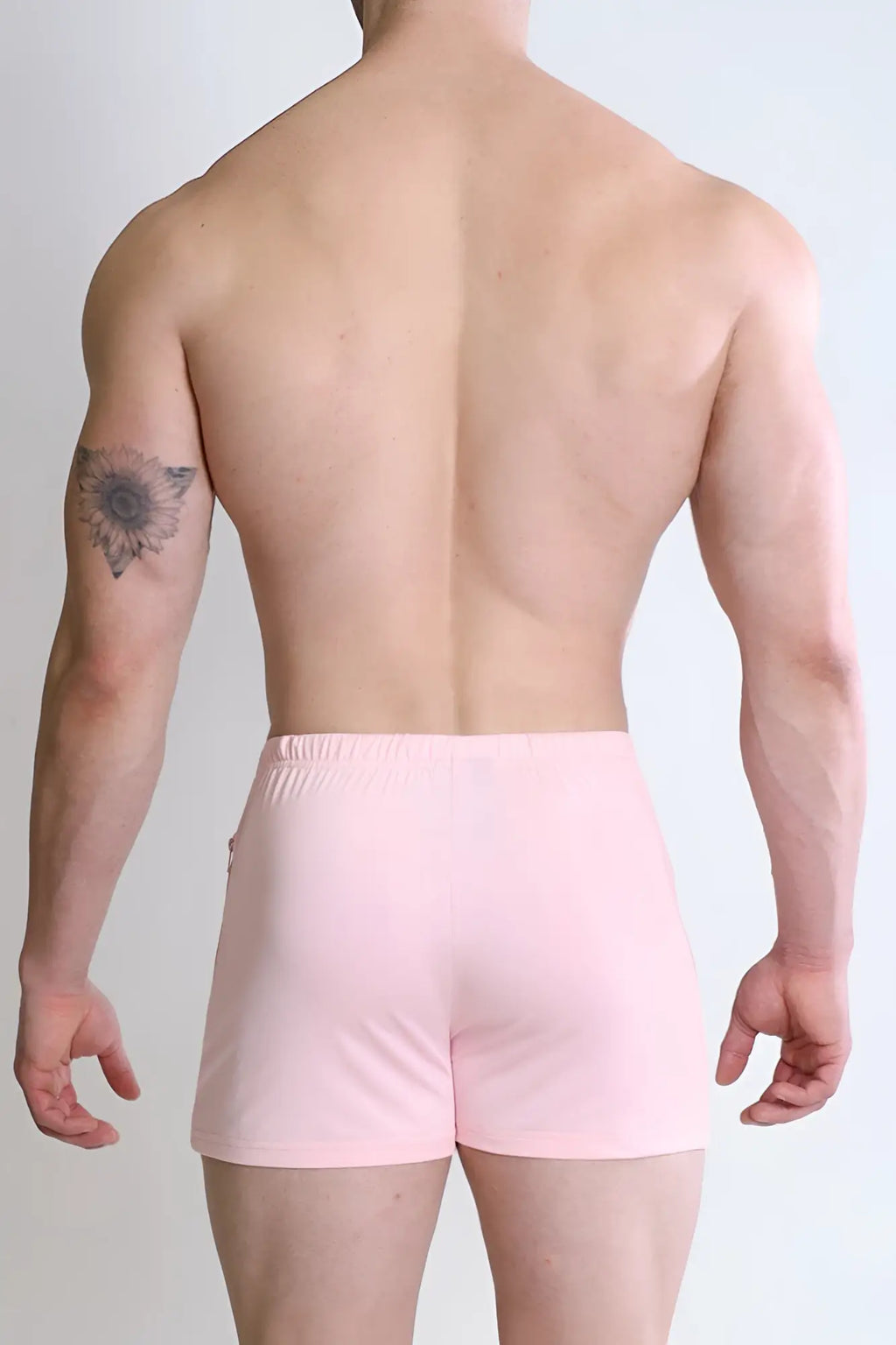 Pink karma 2 inch short shorts with elastic waistband and zipper pockets ideal for athletic activities