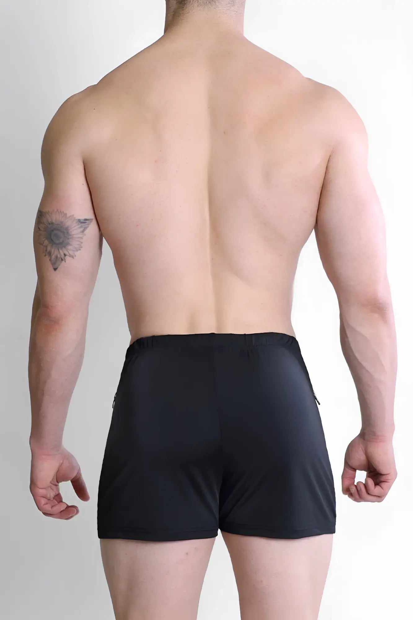 Black karma 2 inch short shorts with zipper pockets featuring a sleek, form-fitting design and subtle side zippers