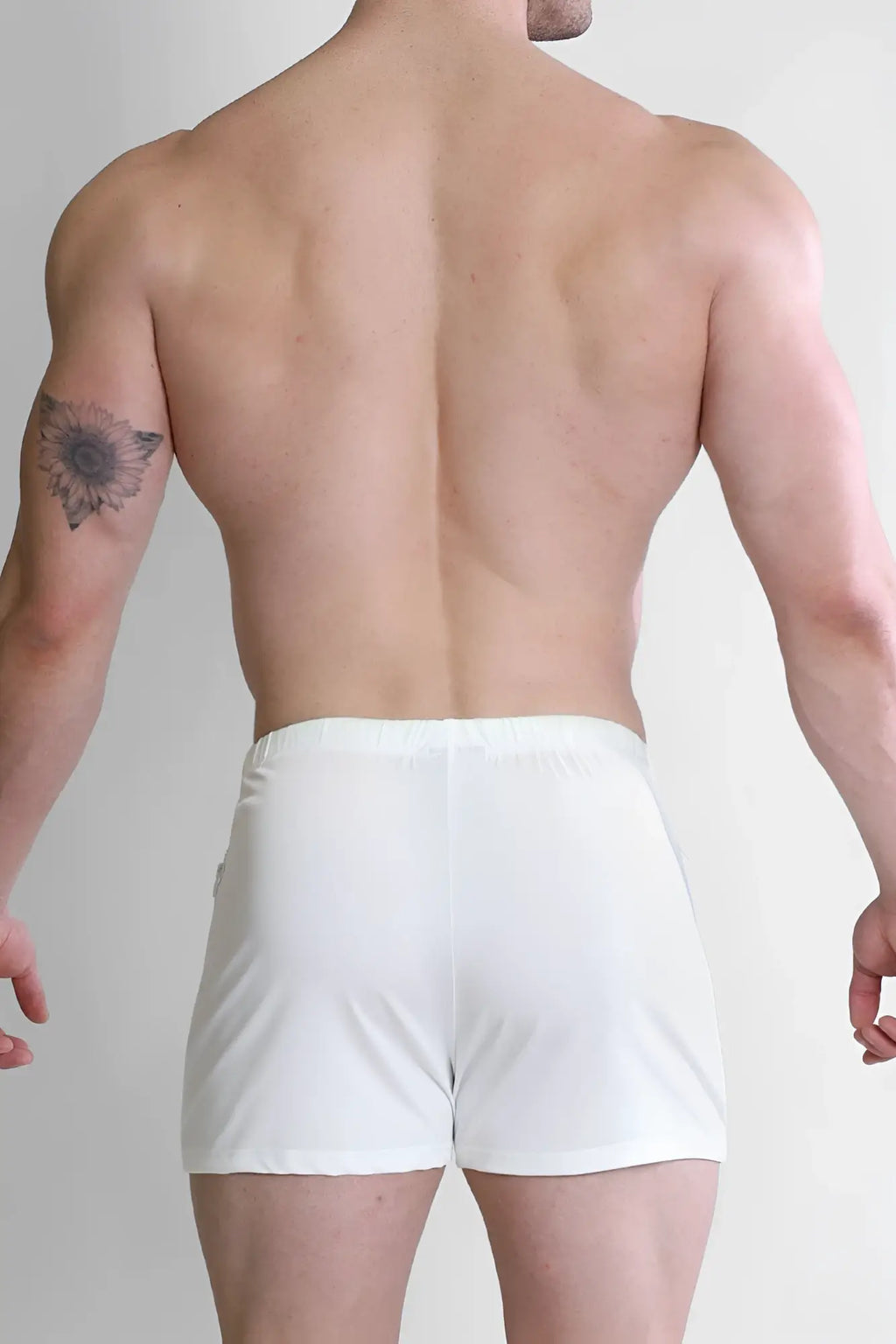 White karma 2 inch short shorts with zipper pockets snug fit elastic waistband suitable for athletic use