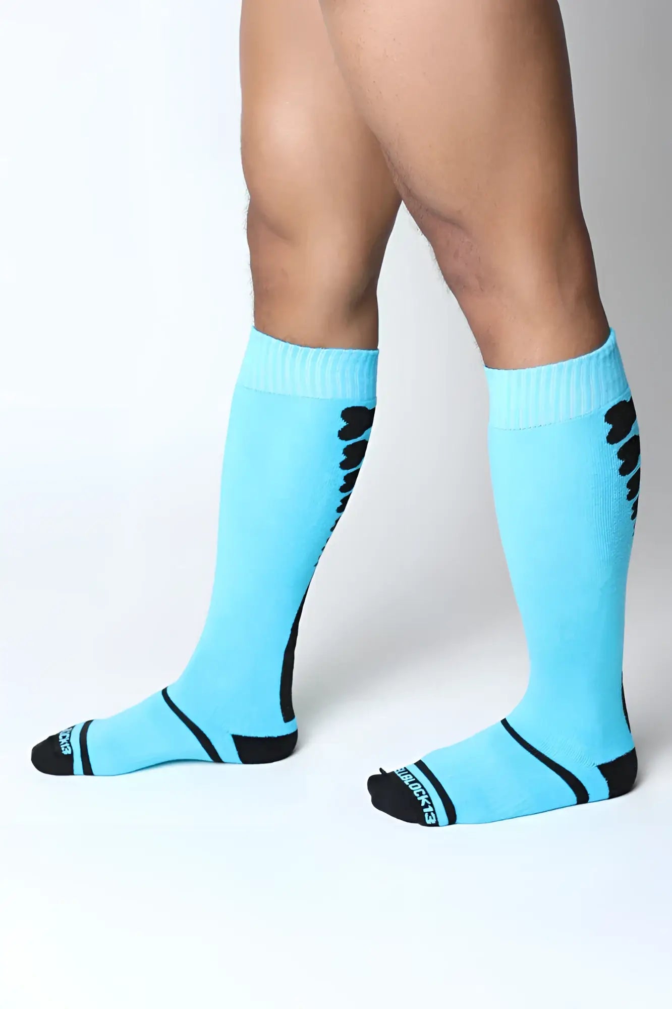 Light blue kennel club bones knee high socks with black accents ribbed cuff and skechers logo on the toe