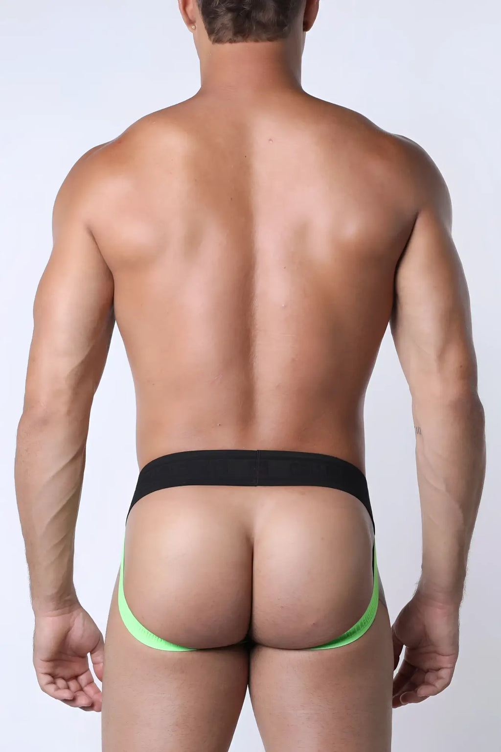 Kennel club lightning jockstrap featuring neon green and black athletic briefs with a snug supportive fit