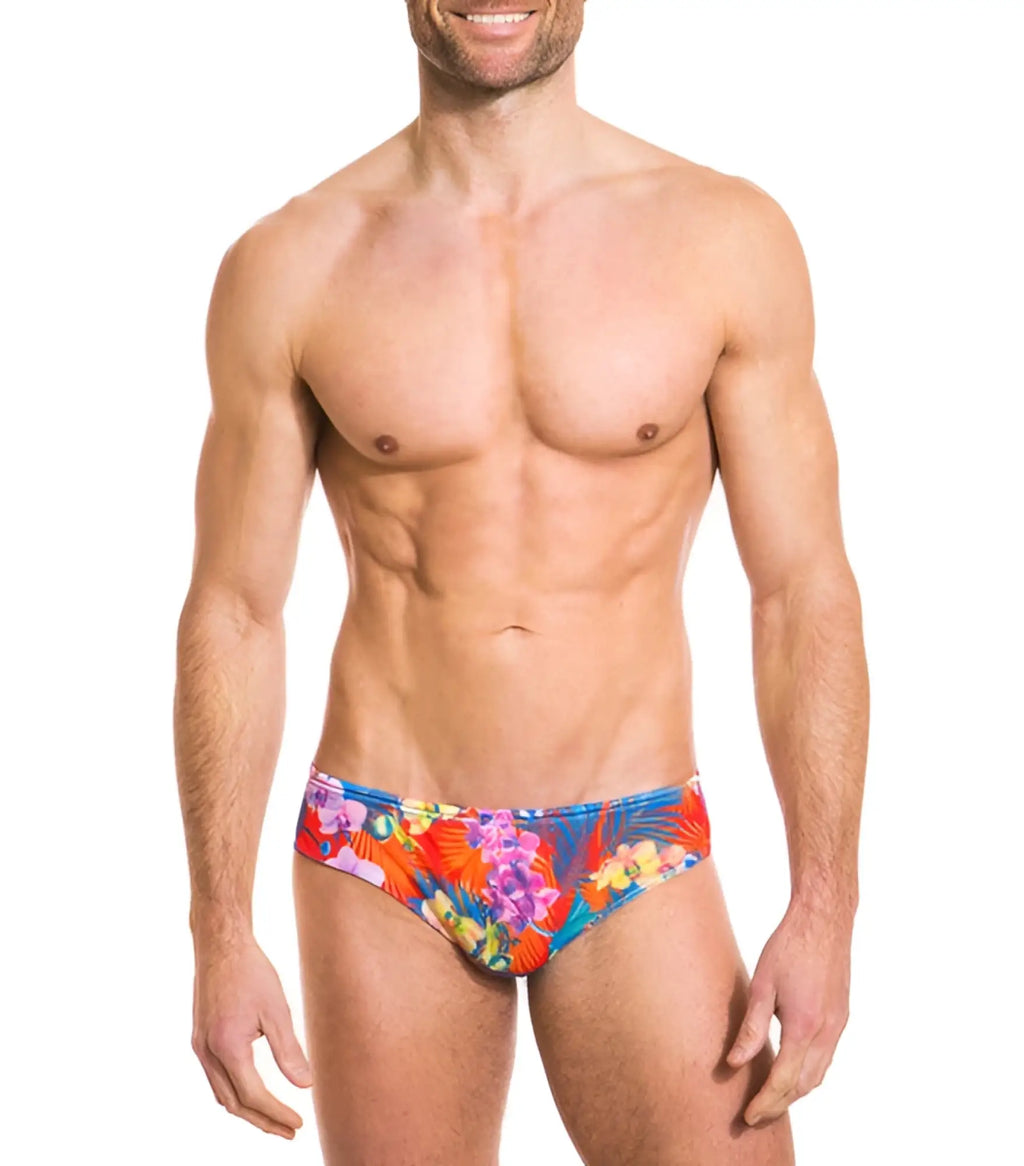 Vibrant tropical floral print kiniki continental tan through deep waist bikini swim trunks in red blue and purple hues size s