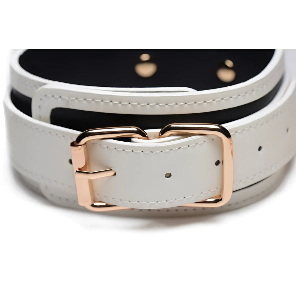 Kink in the dark glowing collar with leash featuring a white leather belt with rose gold-tone buckle and black lining