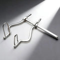 Kink Industries silver metal anal spreader with an adjustable sliding mechanism and two arched insertion prongs.