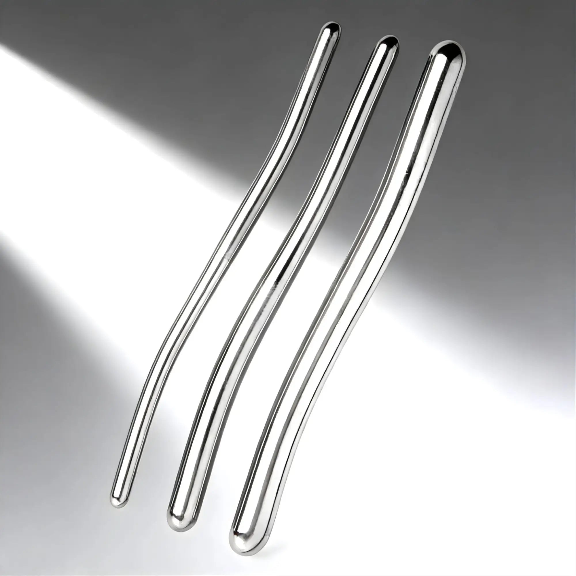 Three chrome-plated Kink Industries Hegar Urethral Sounds of varying diameters, shown against a gradient grey background.