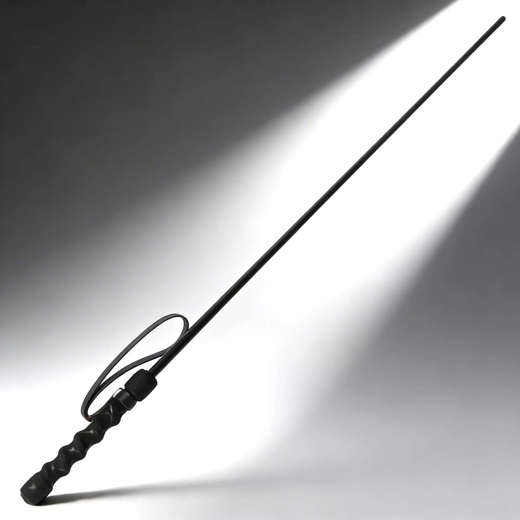 Kink Industries The Intense Impact Cane: a thin black cane with a textured handle and wrist strap on a gray background.