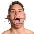 Kink Industries Jennings dental mouth gag: a silver, stainless steel medical-style tool holding a man's mouth open.