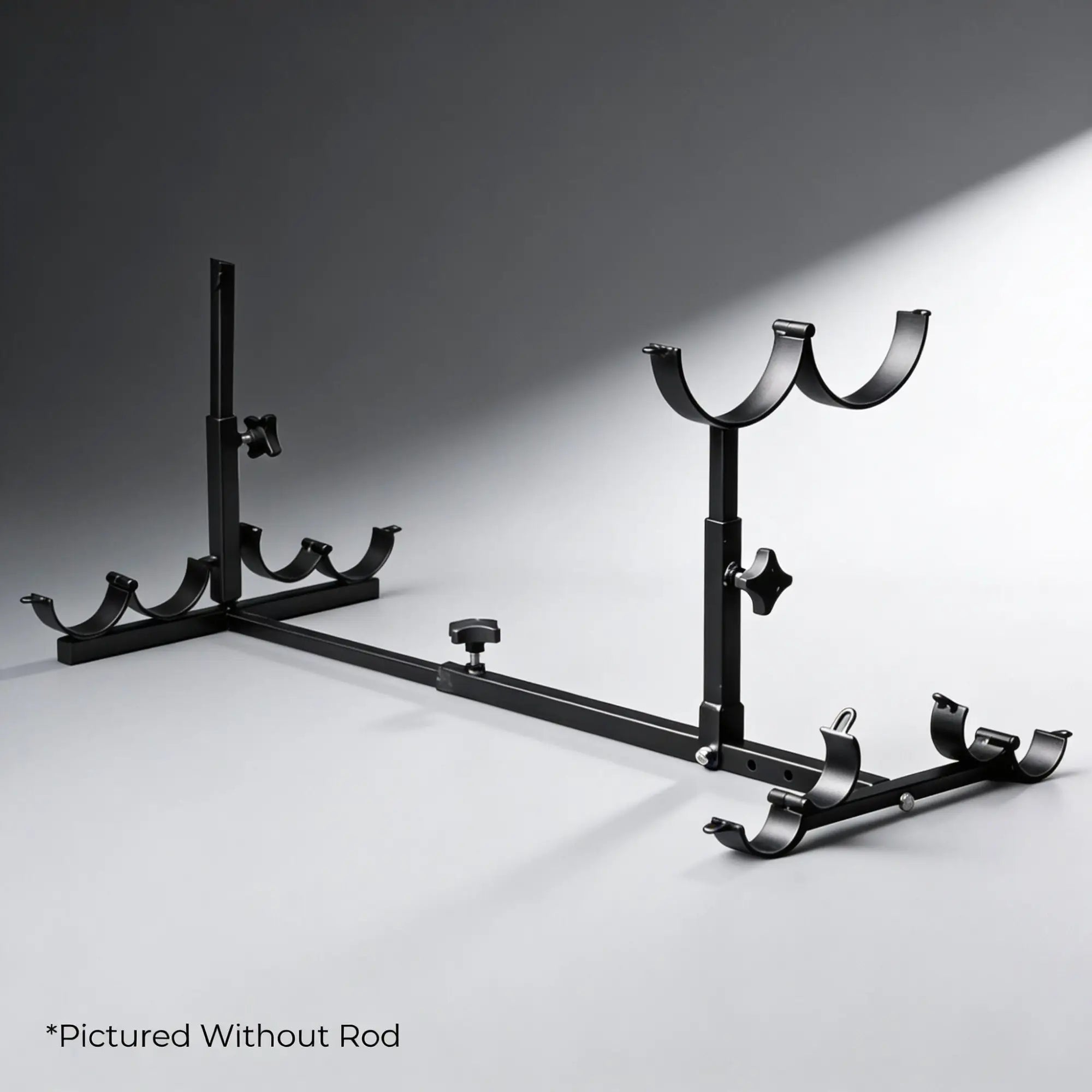 Kink Industries black metal stockade frame with adjustable upright supports and cradles, shown without the optional rod.