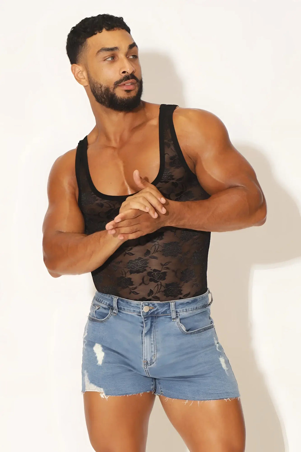 Black lace kiss-it-better lace bodysuit with floral pattern and tank top style front design