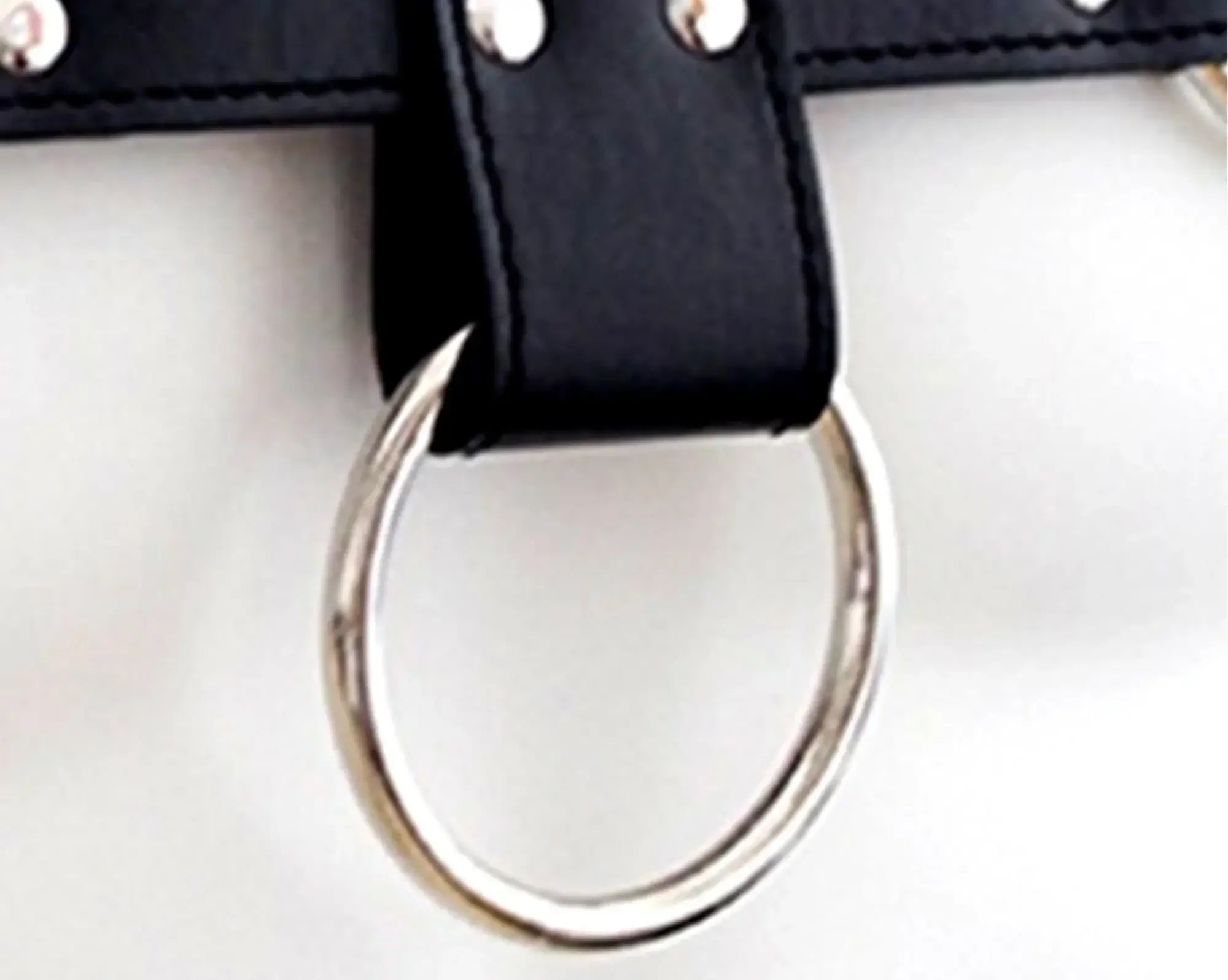 Black leather bulldog harness strap with silver-toned metal ring and rivets for durable secure fit