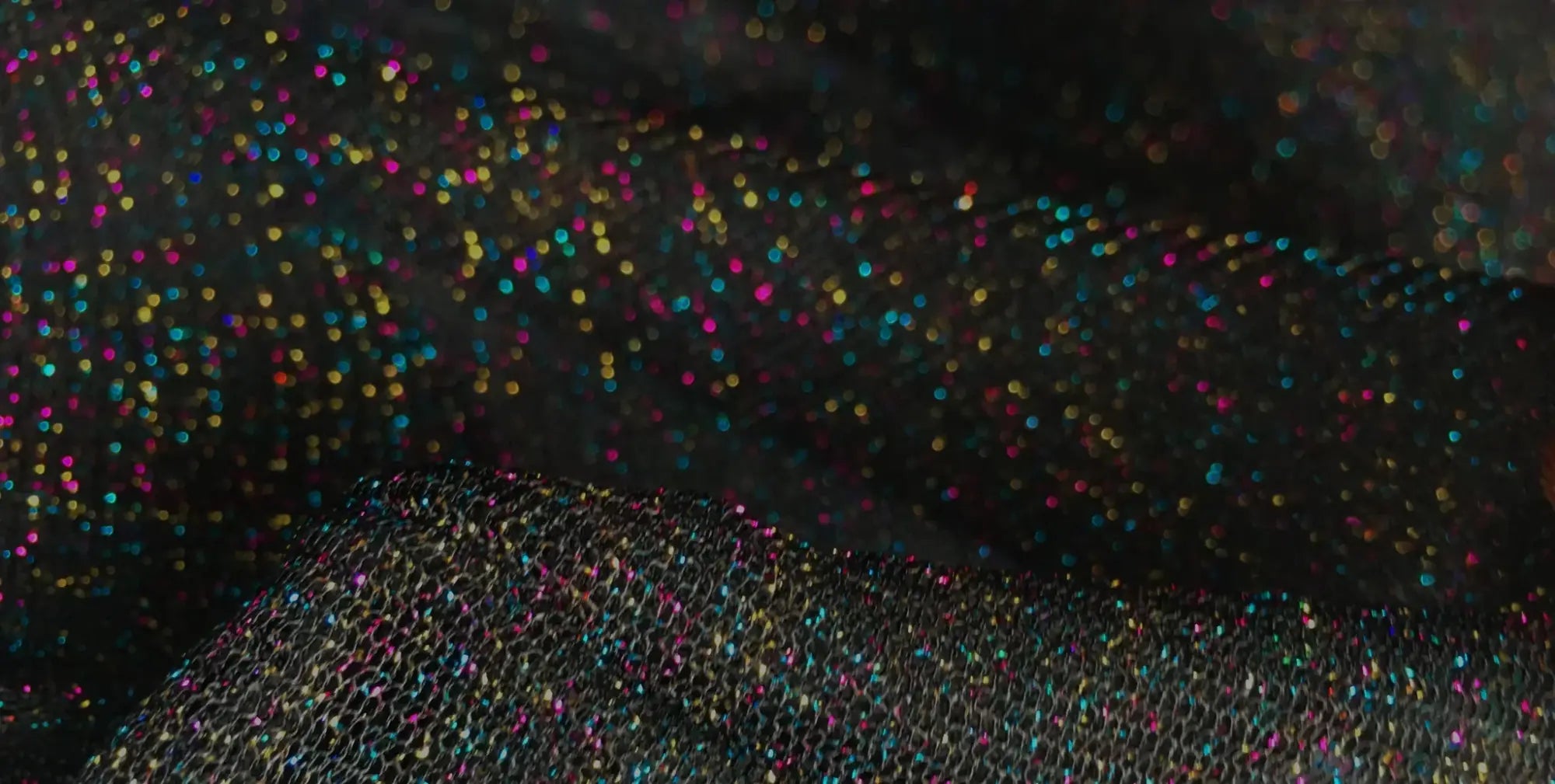 Black mesh fabric glitter mesh tee adorned with sparkling multicolored glitter for a stylish look