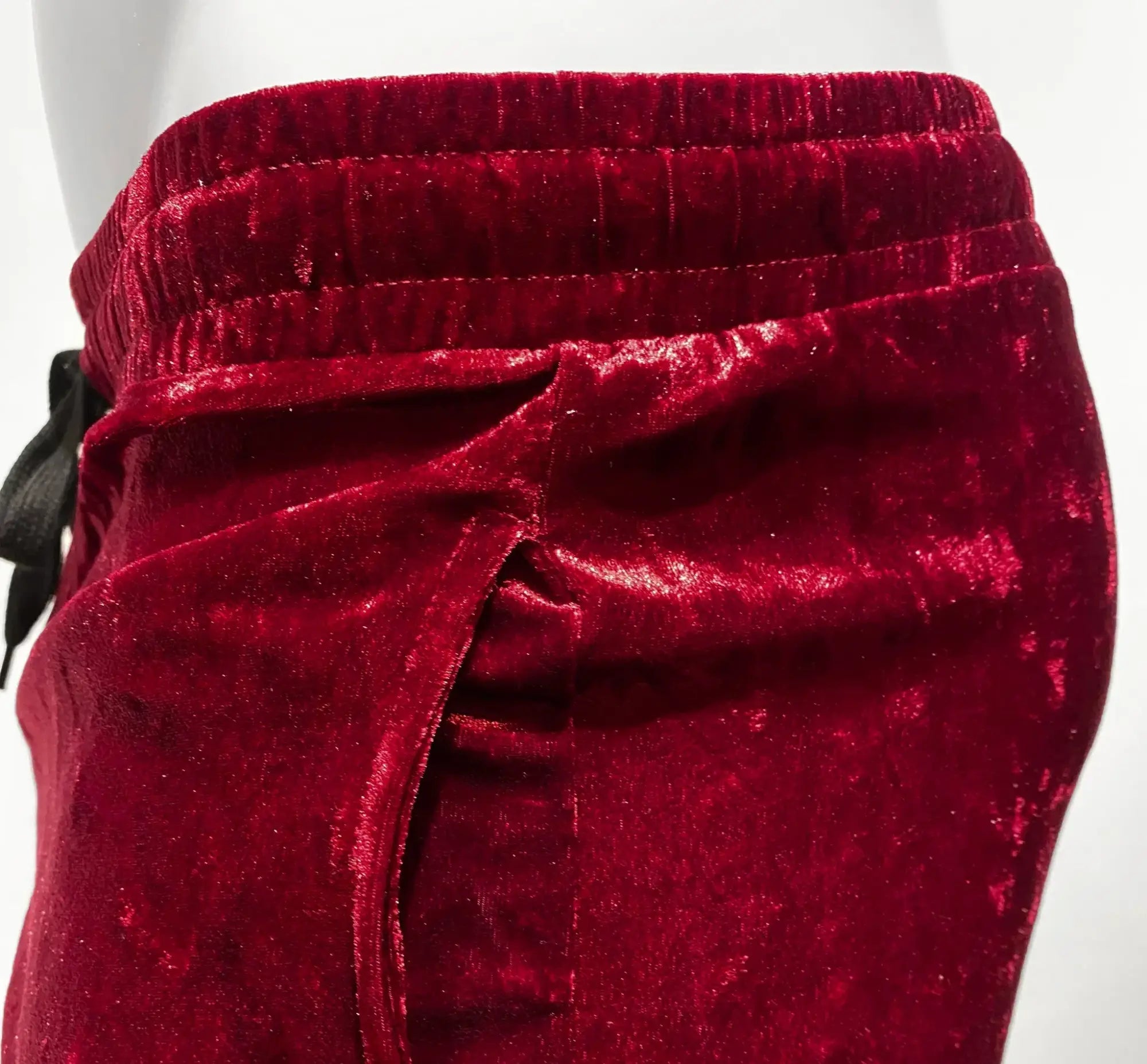 Rich crimson velvet pocket shorts with soft plush texture and elastic waistband for comfortable wear