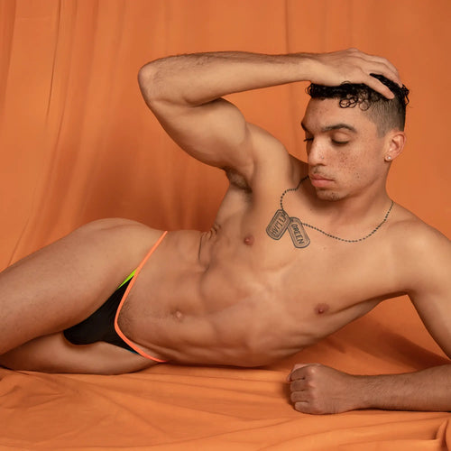 Black and neon orange Kyle KLK021 thong briefs with lime green accent stripe designed for athletic wear