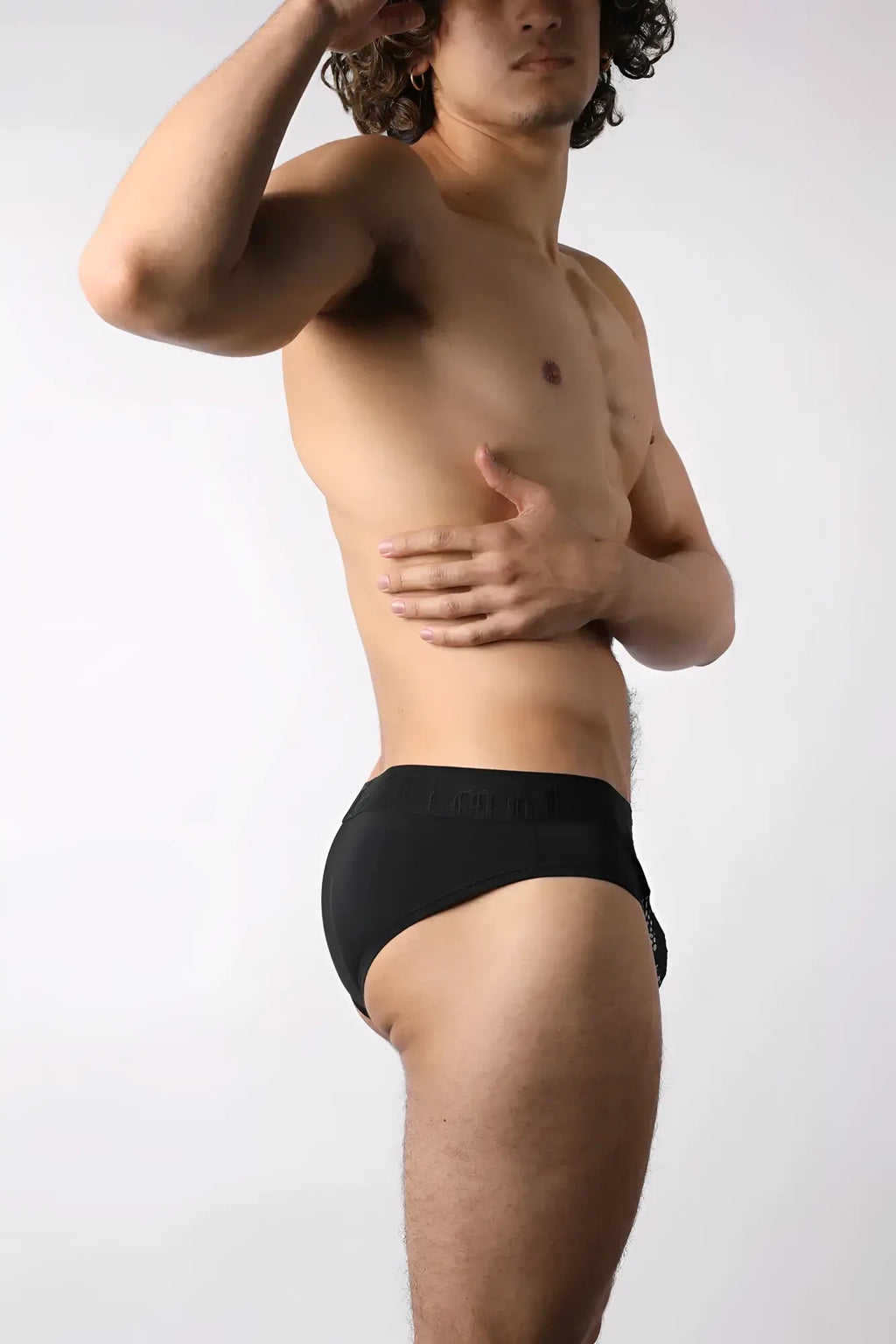 Black lace up low-rise mesh brief with subtle textured waistband shown from the front side